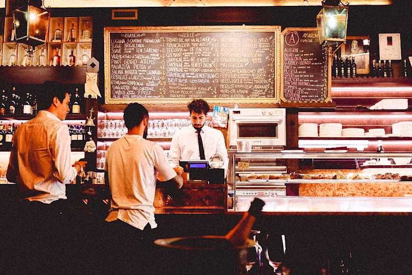Customer paying for their bill at bar