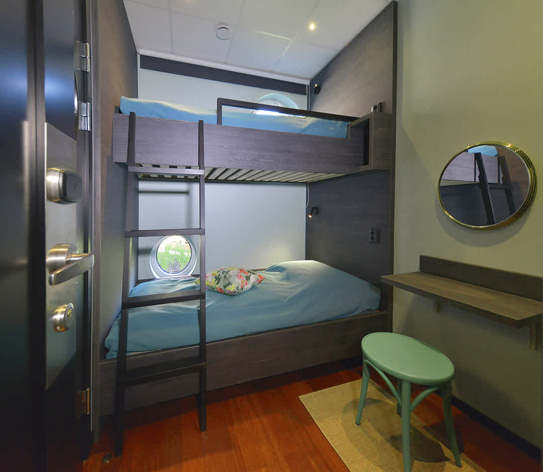 Room Capella at Staykvick Boutique Hostel. Nice turquoise details and a nice bunk bed.