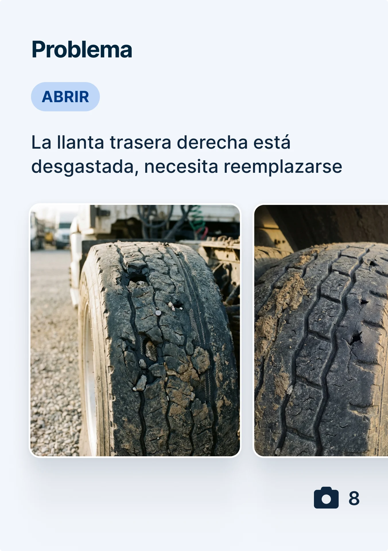 Two images of a severely worn truck tire with cracked tread and visible damage, marked as an open issue for replacement.