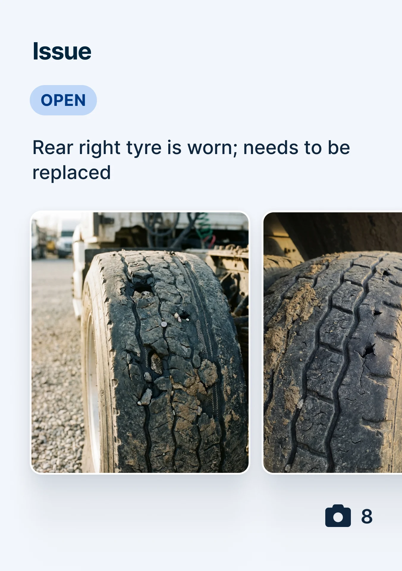 Two images of a severely worn truck tire with cracked tread and visible damage, marked as an open issue for replacement.