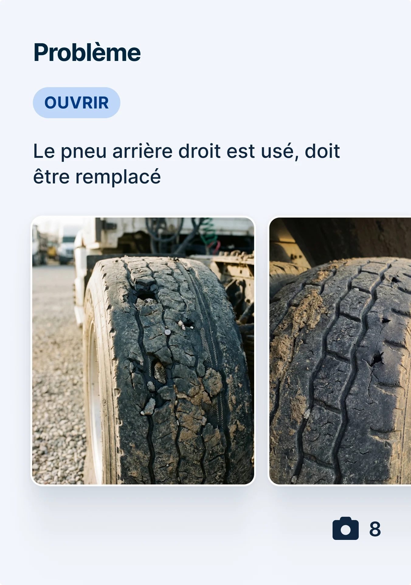 Two images of a severely worn truck tire with cracked tread and visible damage, marked as an open issue for replacement.