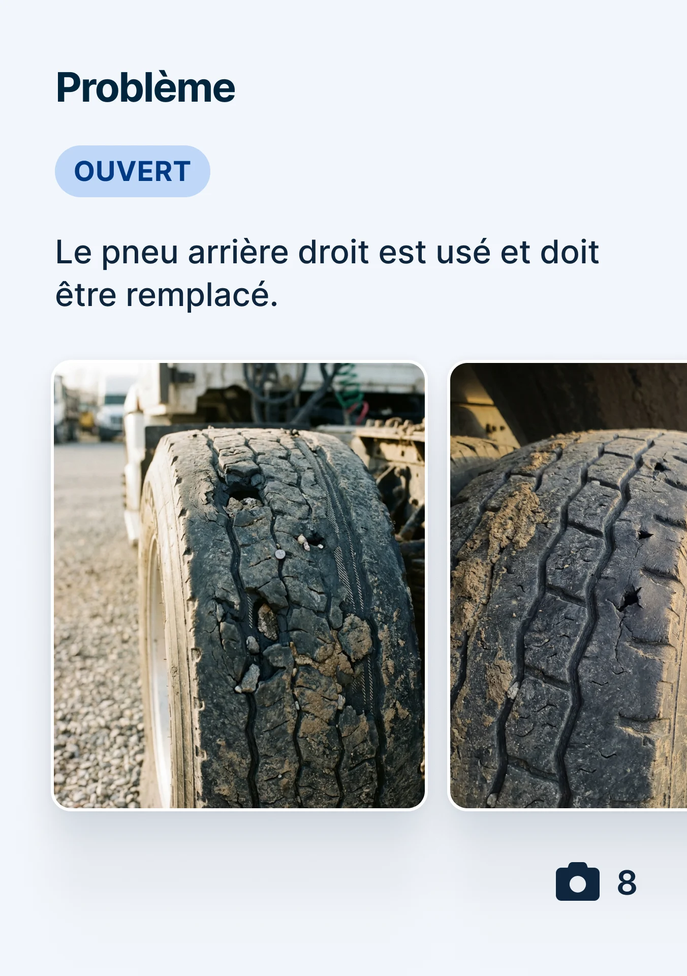 Two images of a severely worn truck tire with cracked tread and visible damage, marked as an open issue for replacement.