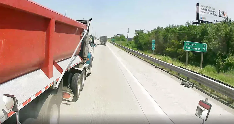 view of a front dash cam recording a truck