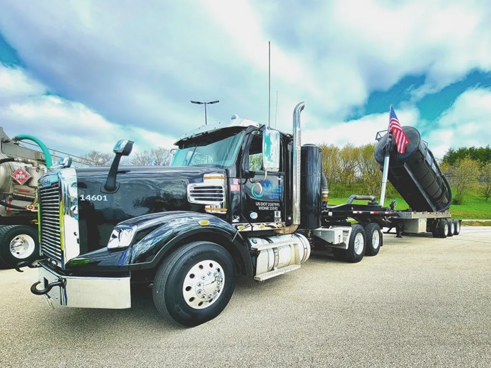 VLS truck in lot with flag