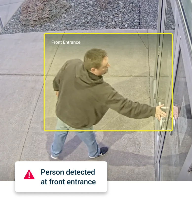 Suspicious person detected at front entrance of building through AI-video video-based solution with alert sent to customer.