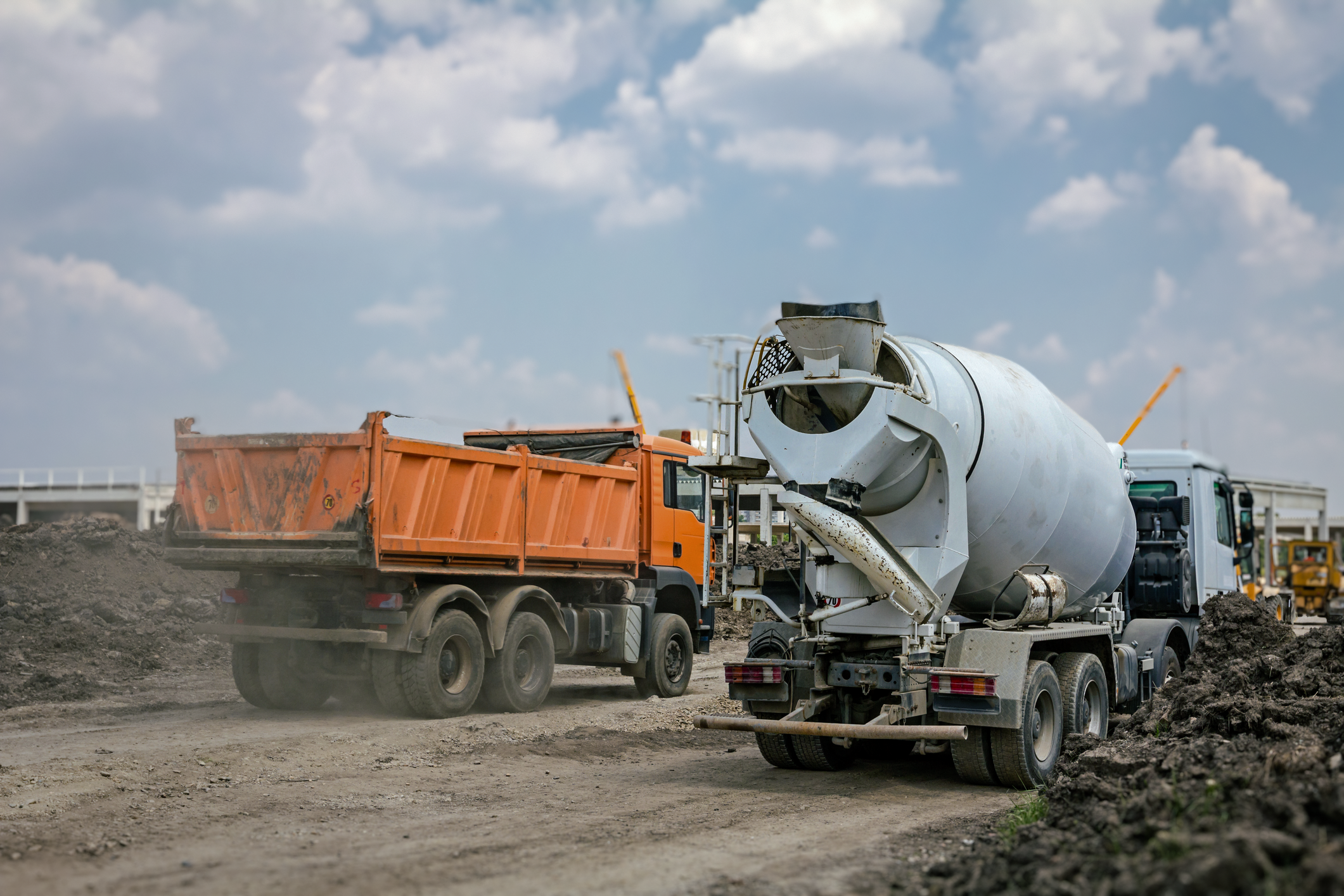 Dump truck and a cement mixer at a work site