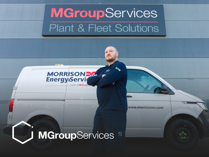 A driver standing in front of their van