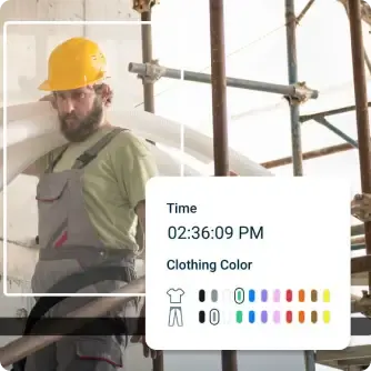 Construction worker in yellow hard hat and green shirt standing at a worksite with digital interface overlay.