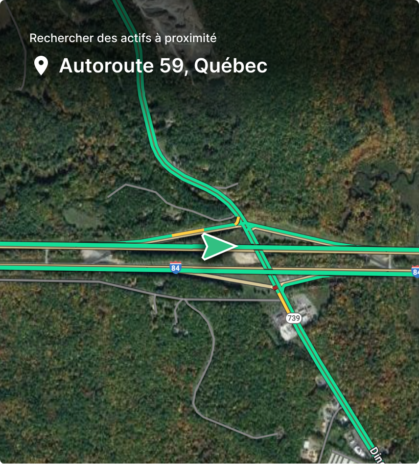 Vue aérienne d'un échangeur routier près de l'Autoroute 59 à Québec, avec routes vertes et jaunes sur fond forestier.