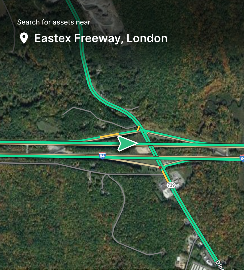Aerial map view of Eastex Freeway junction in London with green highlighted routes and location pin marker.