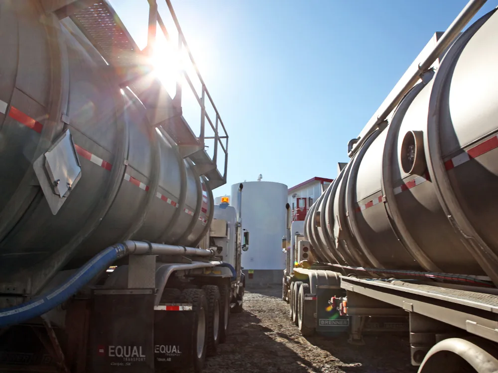 Two CES tanker trucks side by side in the sun