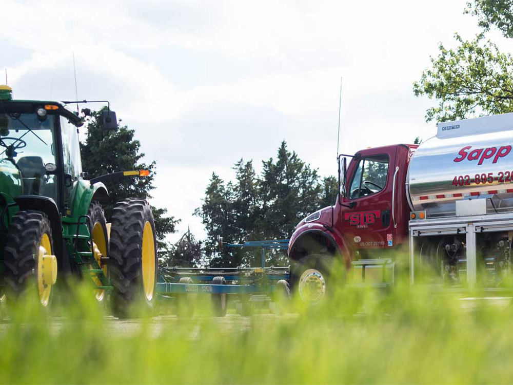Sapp Bros. tanker in field with tractor