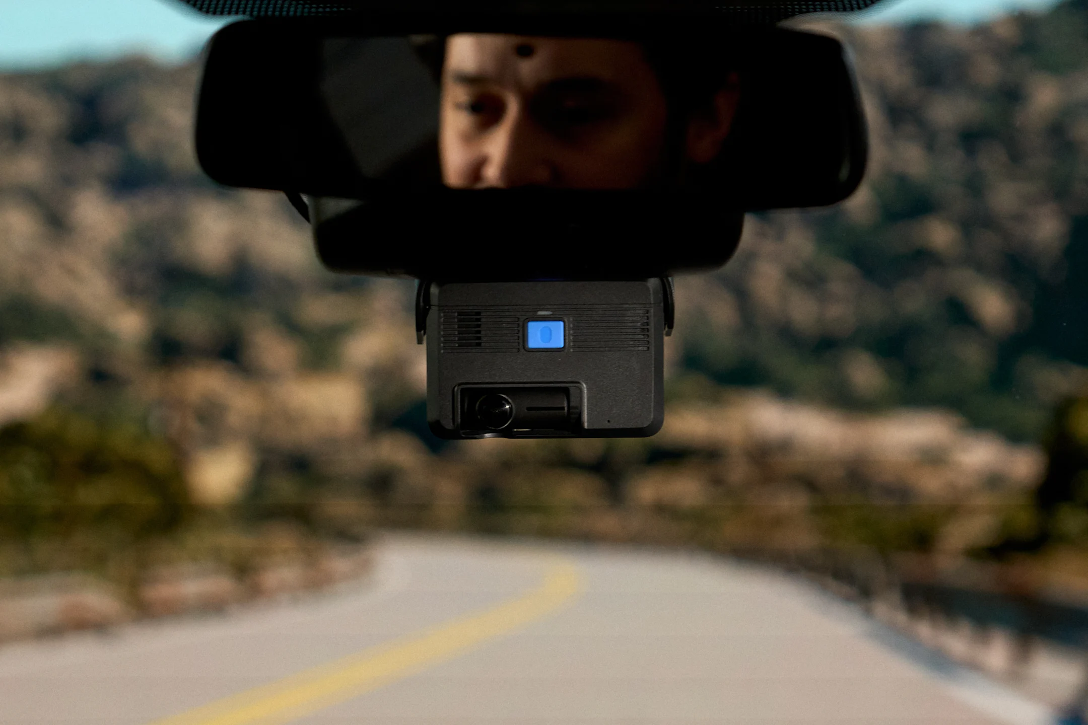 View of road from backseat of truck with Samsara dash cam installed