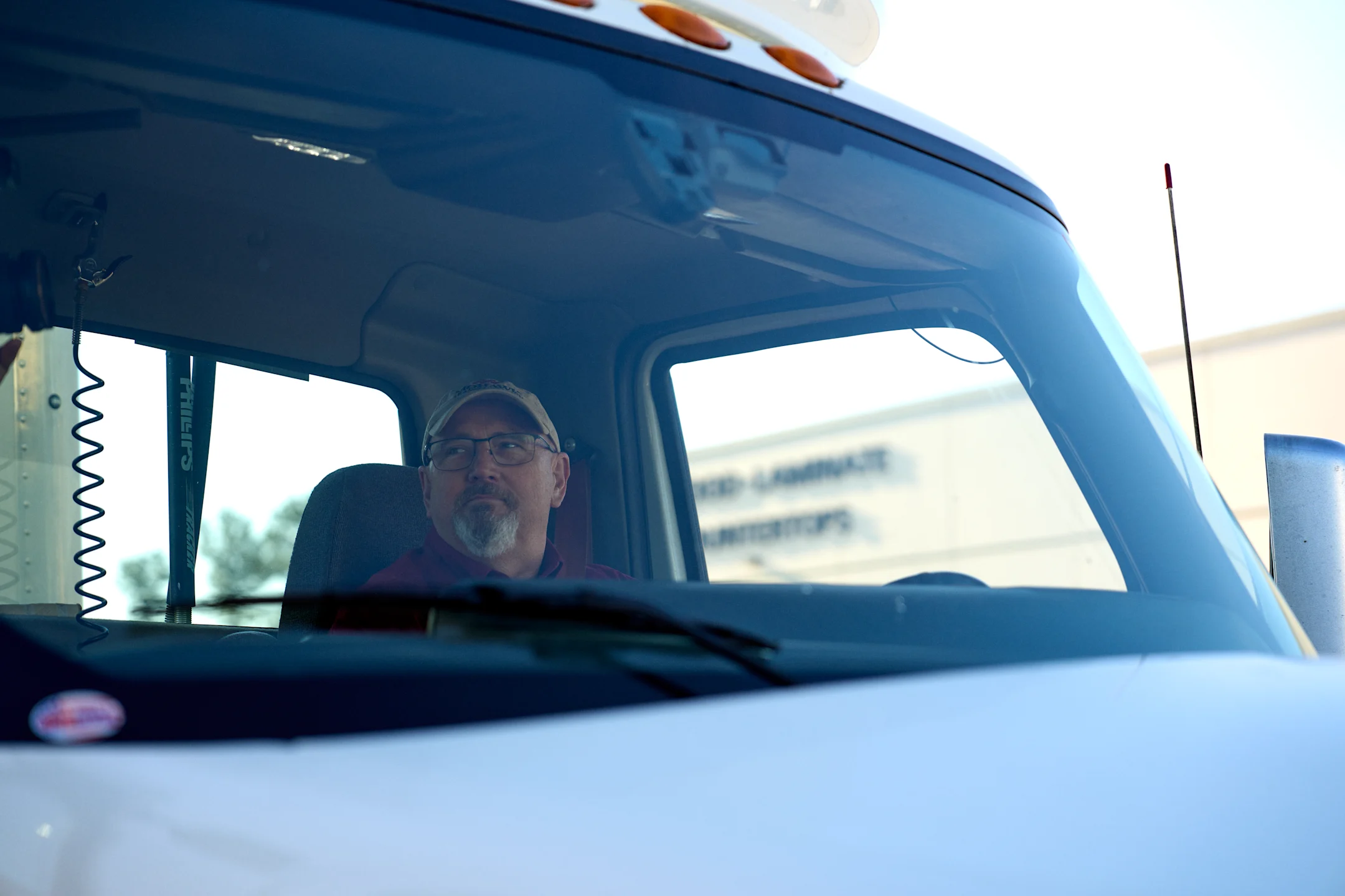 Man sitting in truck cab
