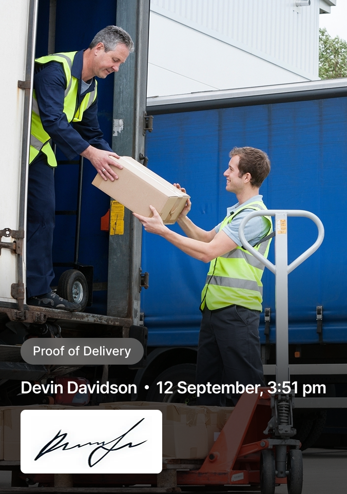 Delivery workers in safety vests transferring a package between truck and hand truck, with proof of delivery signature below.