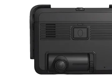 Close-up of a black dash cam device showing a wide-angle lens, ventilation grilles, and a button on top.