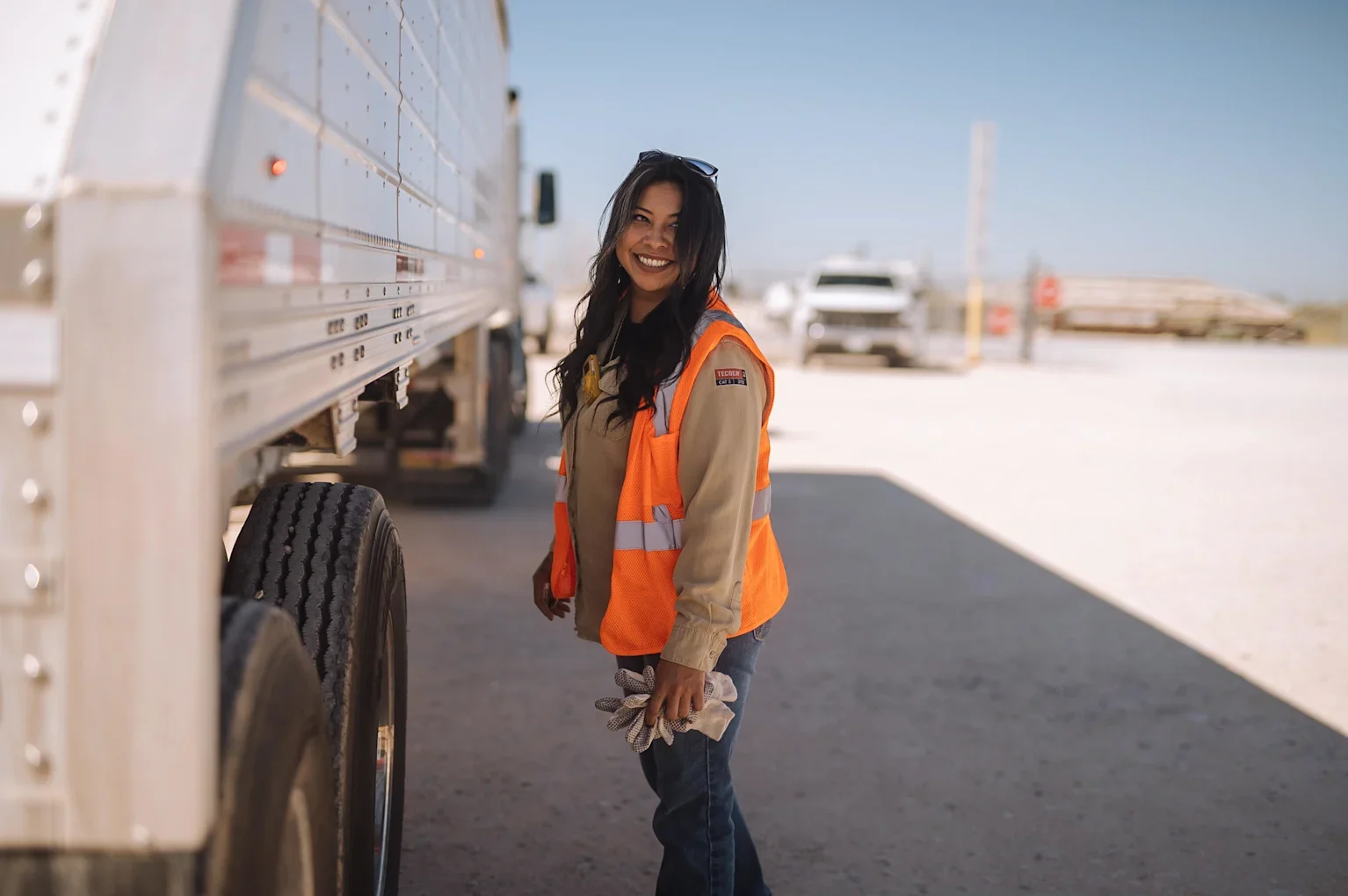 Worker with a safety vest looking at a camera