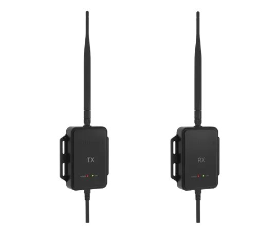 Two black wireless transmitter (TX) and receiver (RX) devices with antennas and indicator lights on a white background.