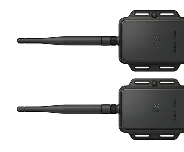 Two black wireless transmitter and receiver modules with antennas, labeled RX and TX, shown on white background.
