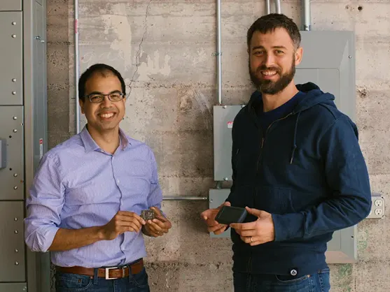 Samsara founders standing in an industrial workspace