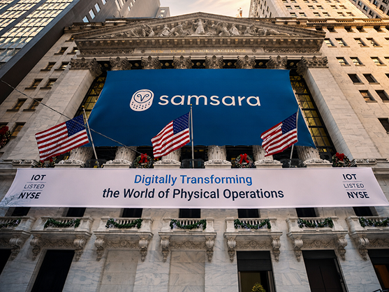 NYSE building adorned with Samsara banners and US flags.