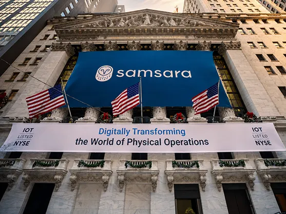 NYSE building adorned with Samsara banners and US flags.