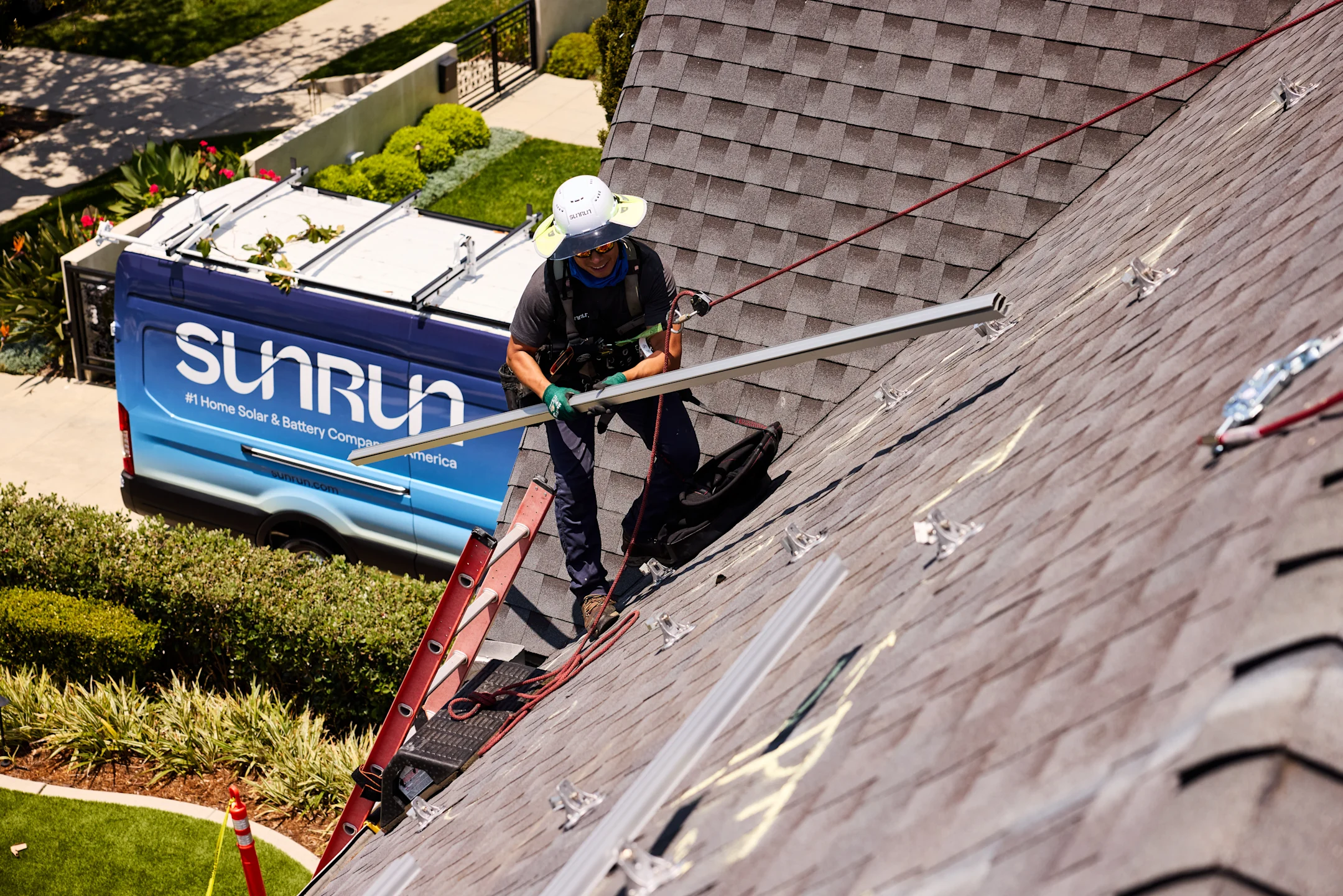 Sunrun installing solar panel on roof