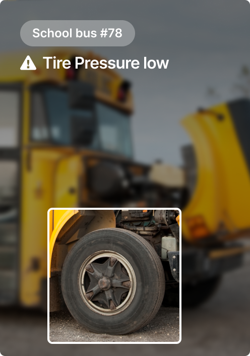 Yellow school bus #78 with warning alert showing low tire pressure, featuring close-up of a deflated tire.