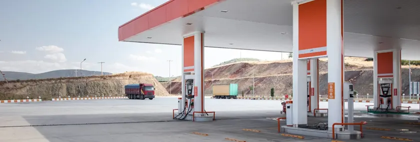 red truck at a gas station