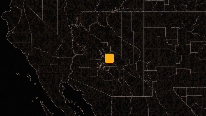 Dark map of the western United States with an orange square marker highlighting a location in the Phoenix region.