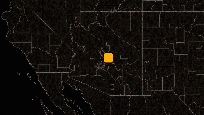 Dark map of the western United States with an orange square marker highlighting a location in the Phoenix region.