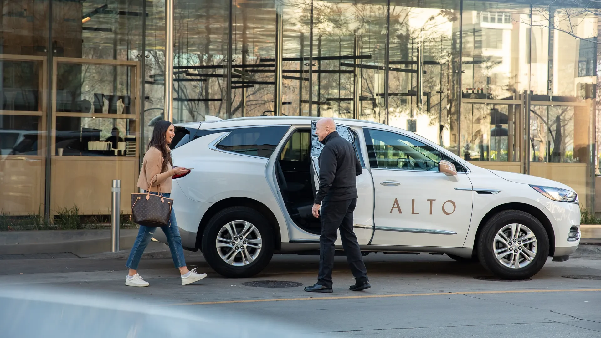 Woman entering ride share vehicle