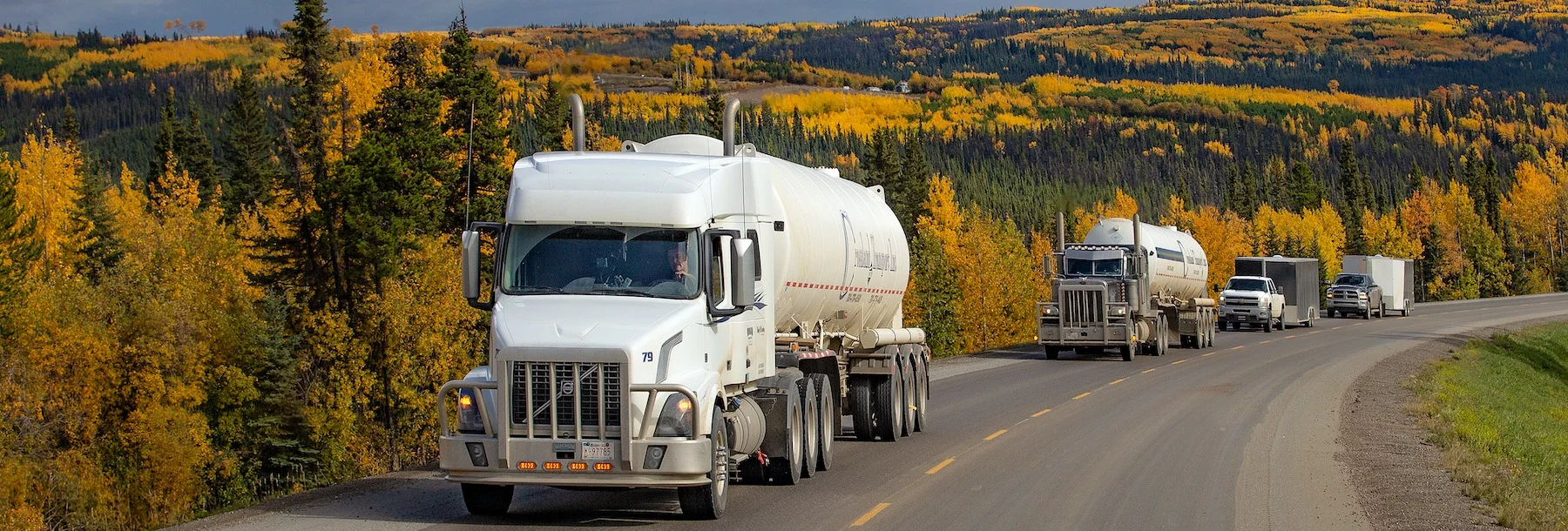 Semi truck with trailer driving on highway in Yukon