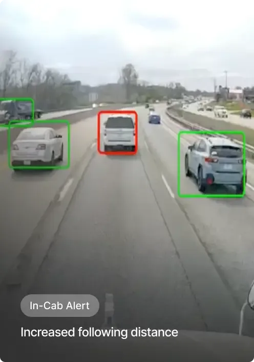 Highway view from vehicle showing traffic with highlighted cars and an "In-Cab Alert" warning about following distance.