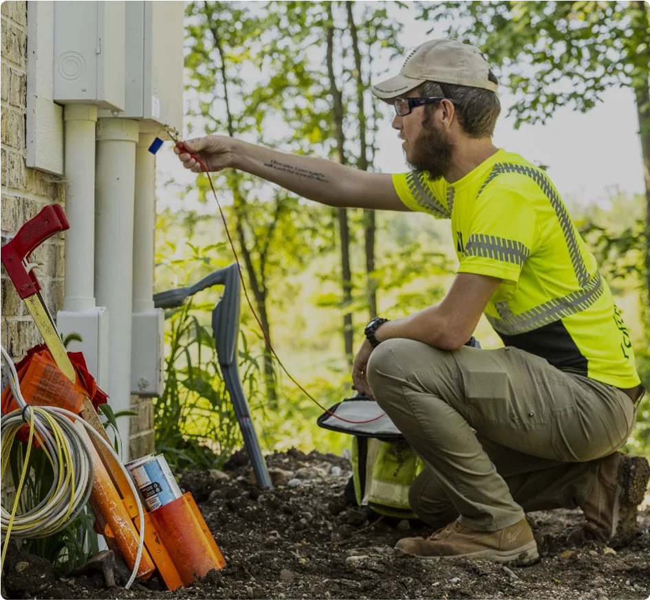 man in PPE gear working outside