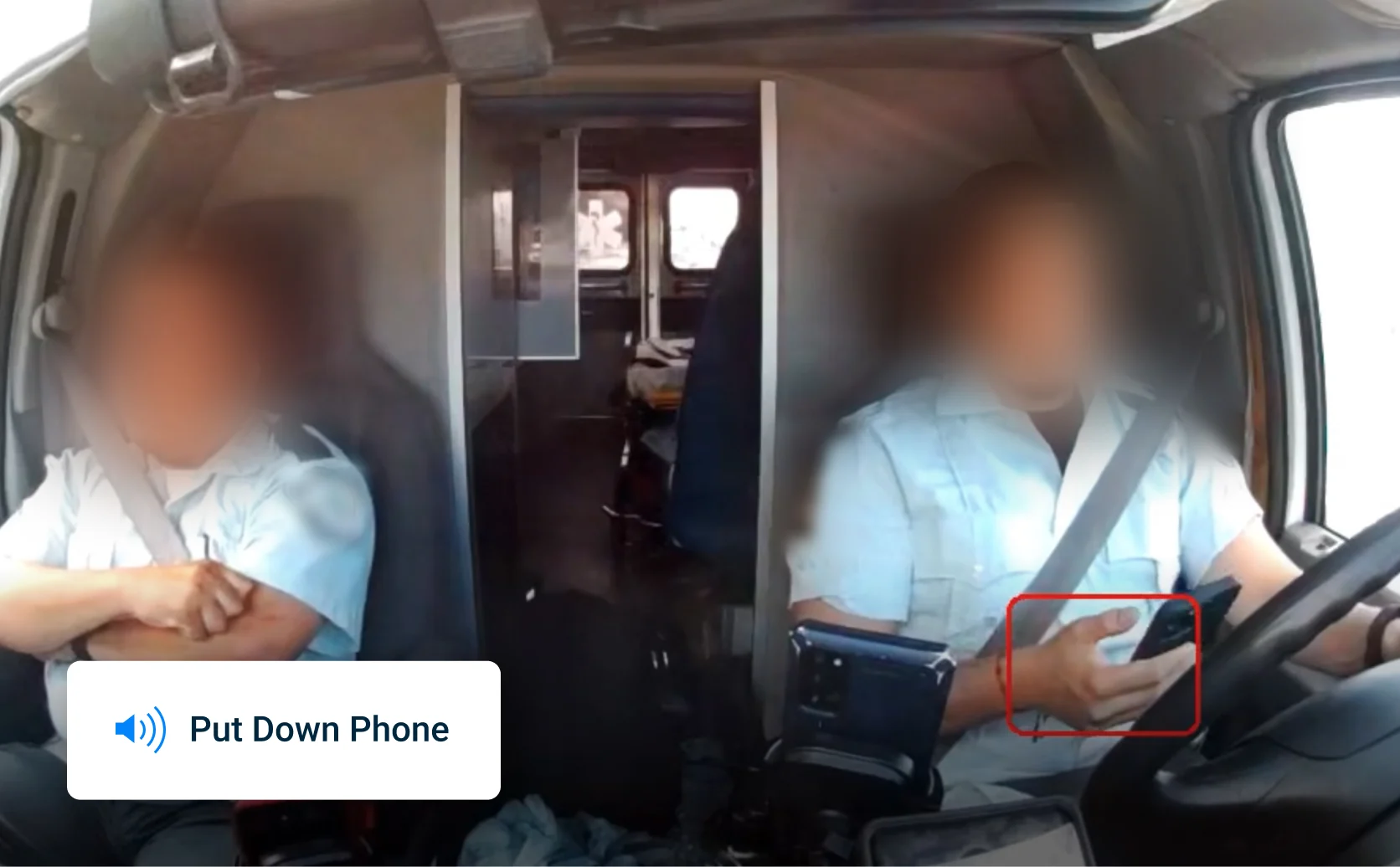 Image of driver using a mobile device. Overlay of alert sent to their mobile device stating to “put down the phone.”