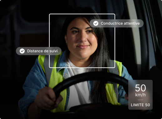 Driver in safety vest behind wheel with monitoring interface showing "Driver Attentive" and speed limit indicators.