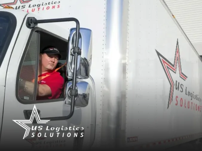 Univar Solutions employee smiles happily while driving truck.