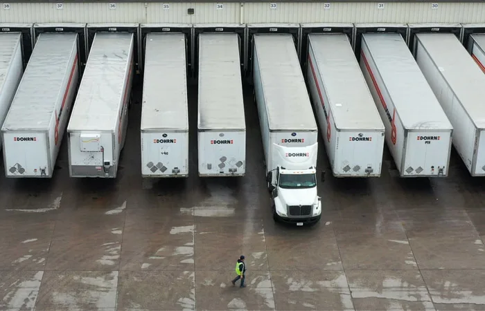 Picture of trucks in line at warehouse