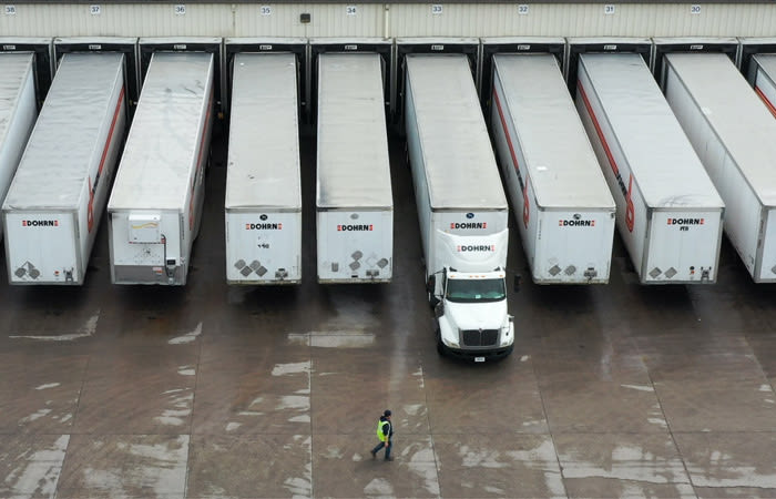 Picture of trucks in line at warehouse