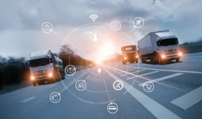 Commercial trucks driving on a highway.