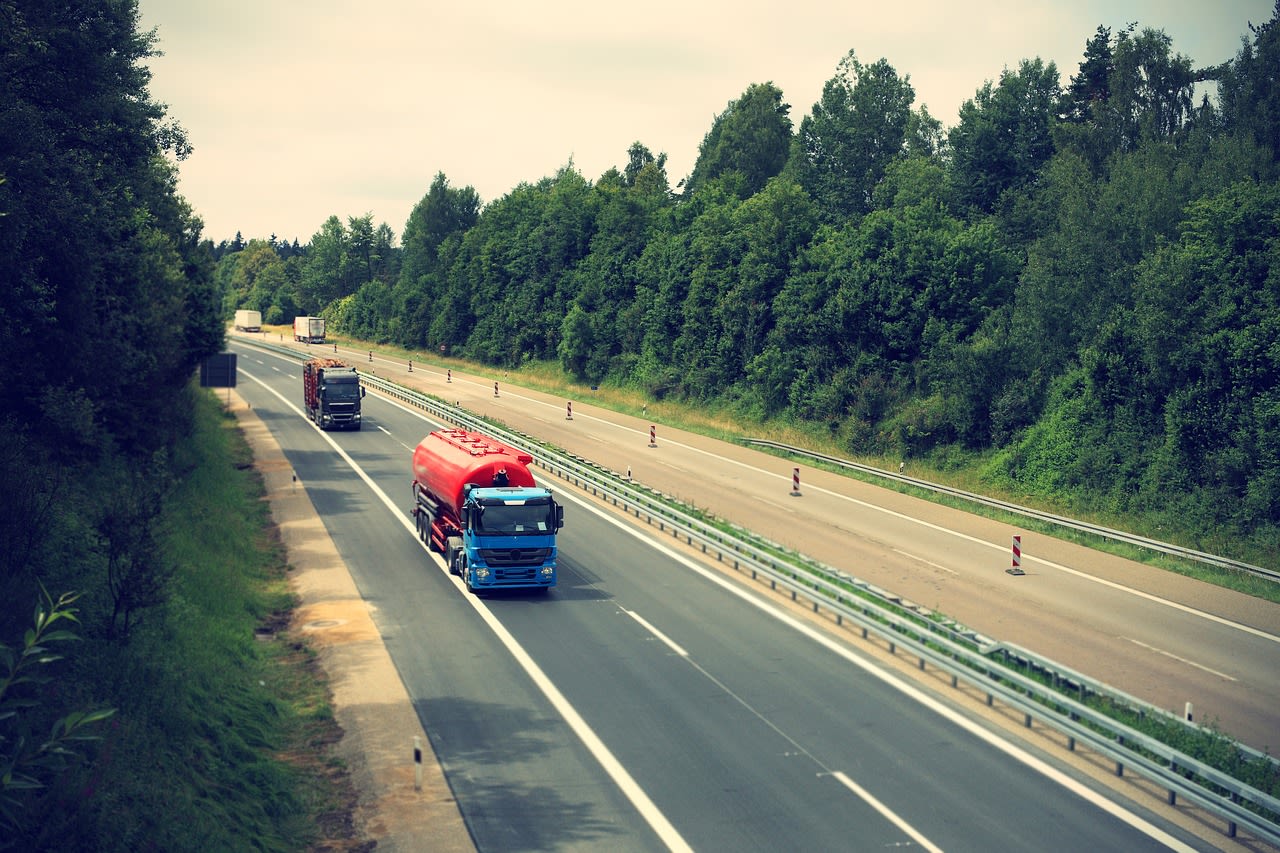 trucks driving down highway
