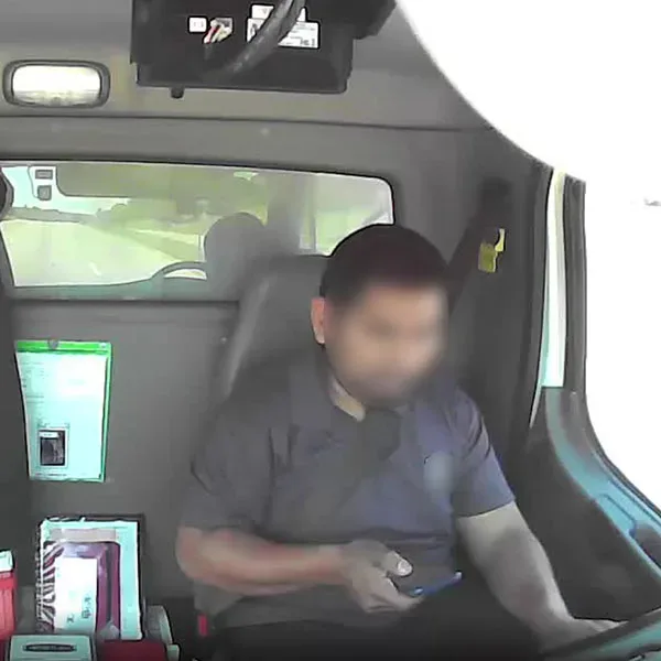 driver looking at the phone while driving