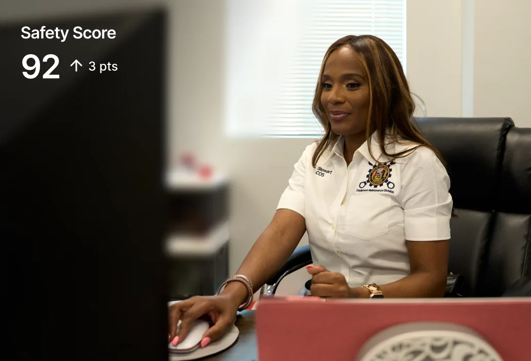 A person working on a computer. Text: &quot;92 up 3 points&quot; appears on the left.