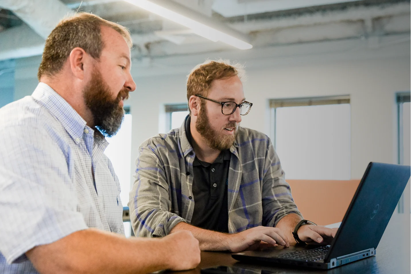 two people looking at computer for training course
