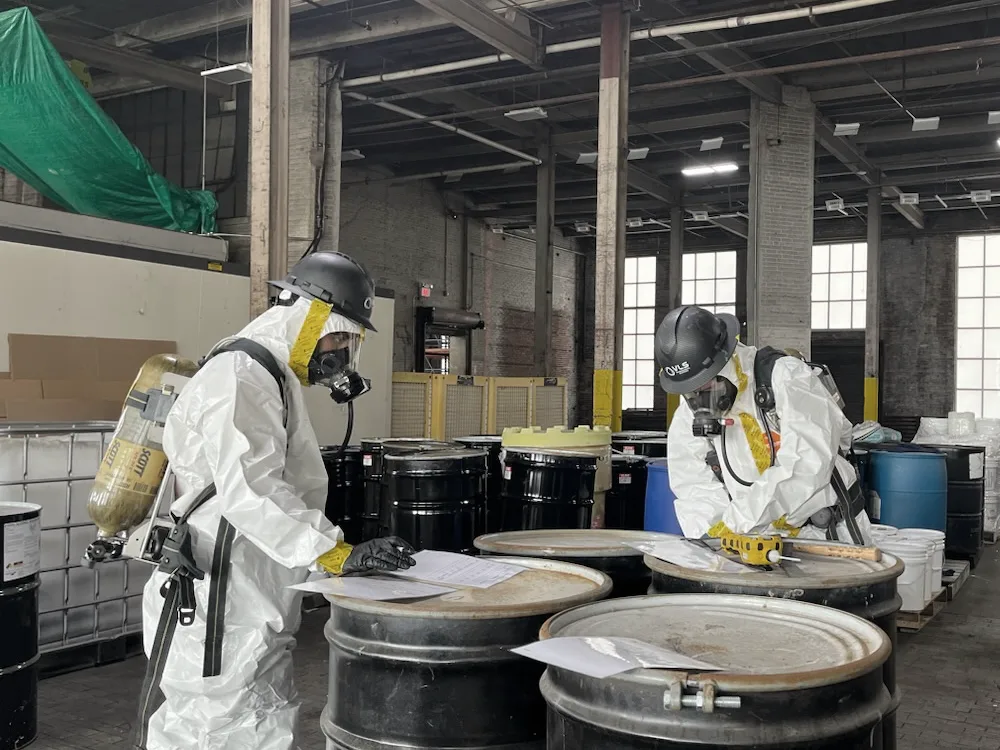 VLS workers safely disposing waste