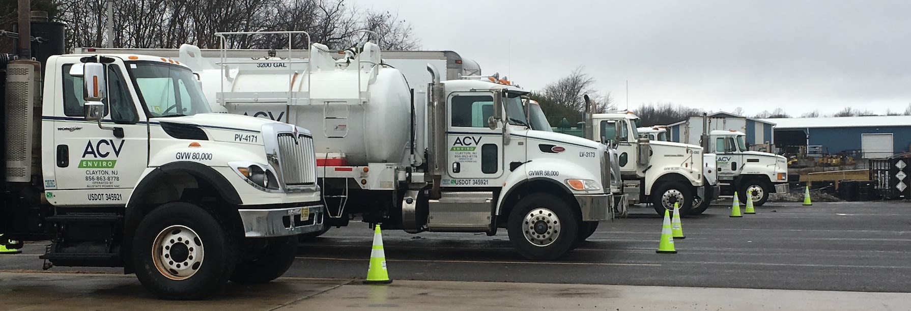 ACV Enviro vehicles in a parking lot. 