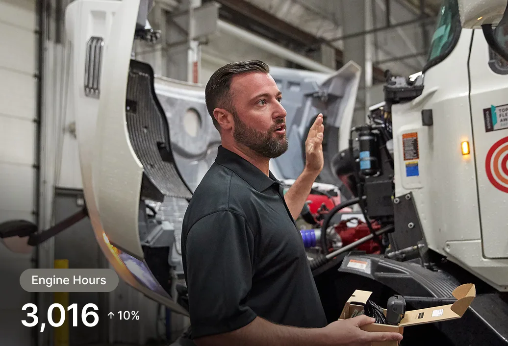 A person inspecting an engine