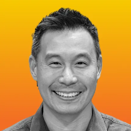 Dave Tu shown in black and white against a vibrant orange-to-yellow gradient background.