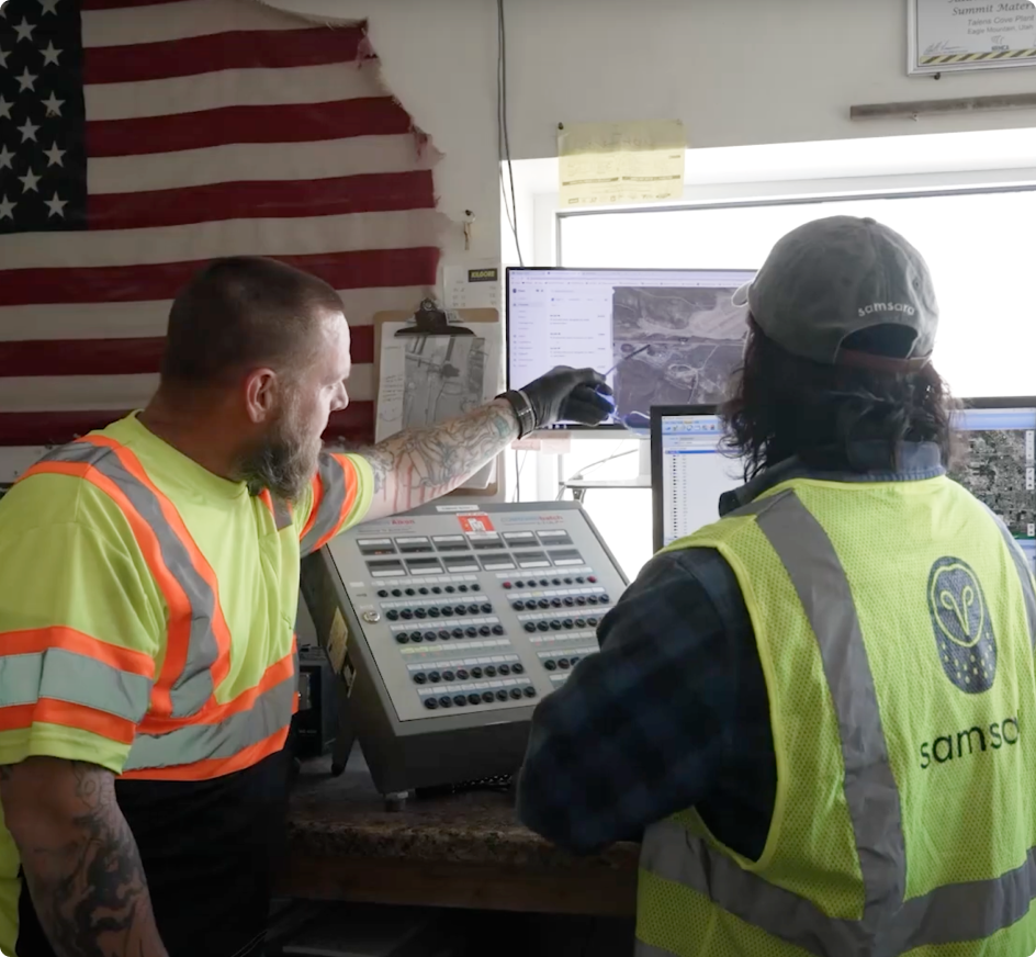 Aerial view of highway with semi-truck and cars, highlighted by blue circular sensor or detection zone overlay.
